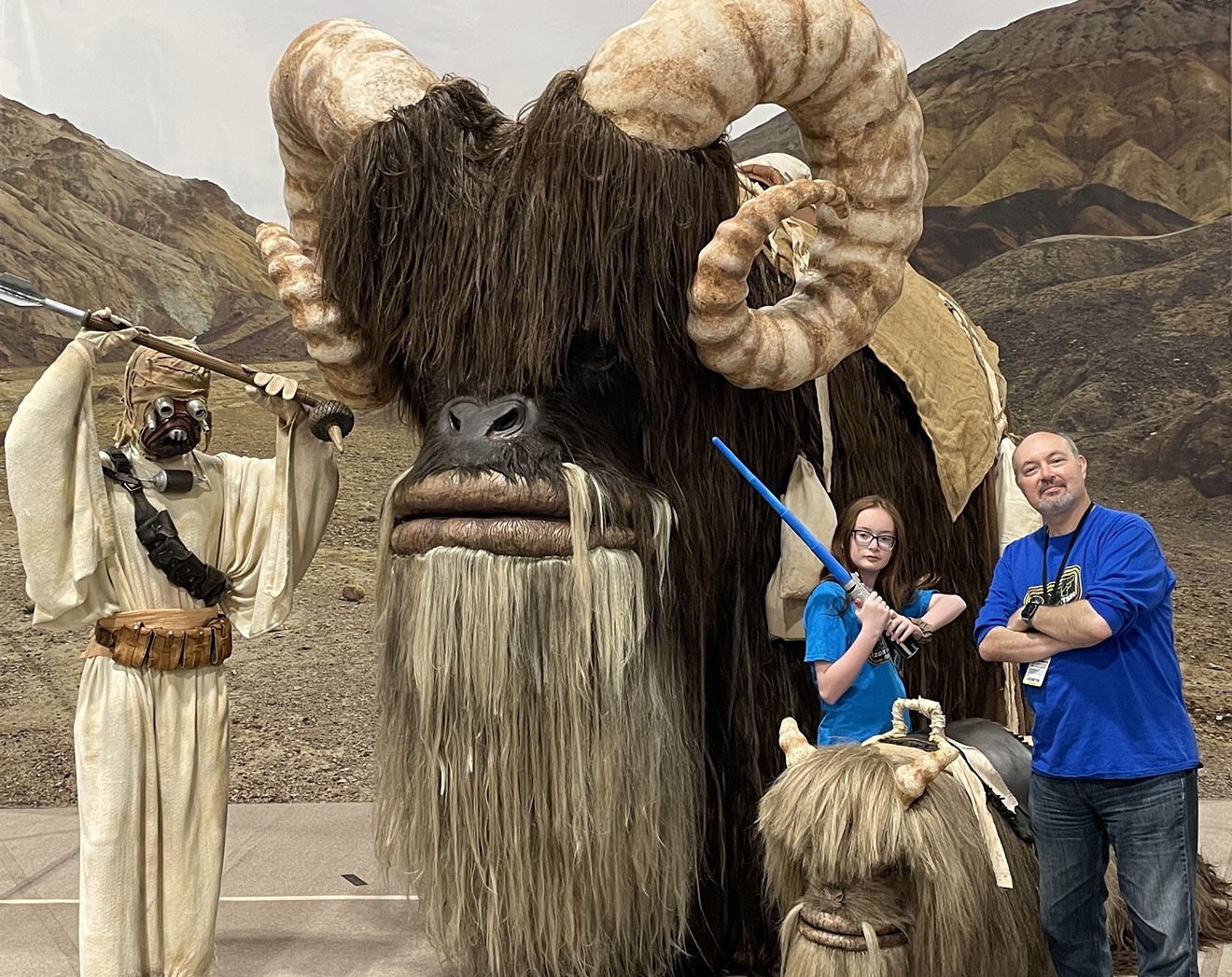 Michael Newman with his daughter at Denver Comic Con (with a Tusken Raider and banthas).