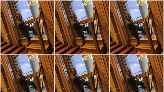 Senate Minority Leader Paul Lundeen climbing out a window in the Senate.