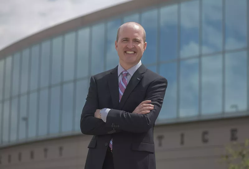 Image: District Attorney Brian Mason smiling.