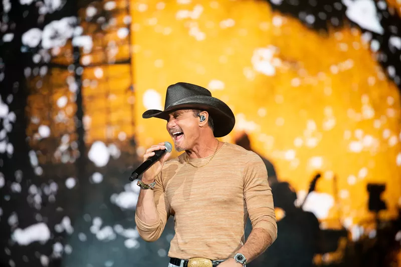 Image: man in cowboy hat singing