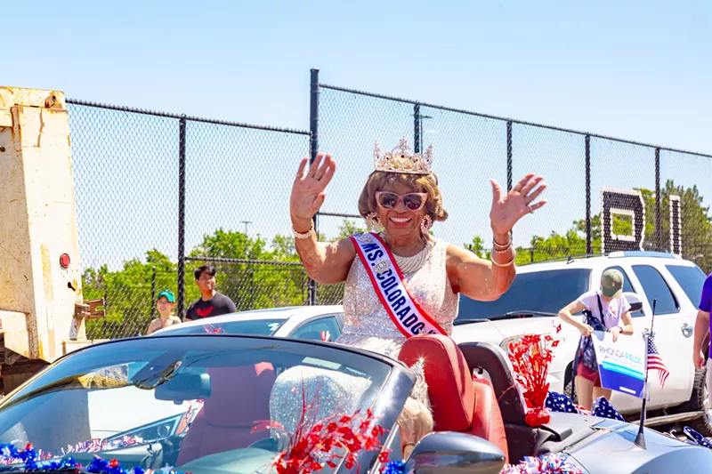 Image: Parade participant waves.