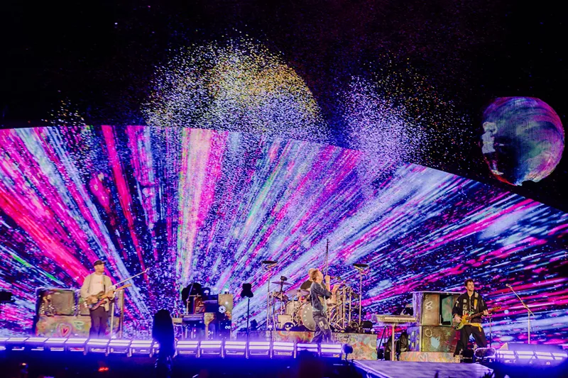Image: Coldplay on stage at Empower Field at Mile High.