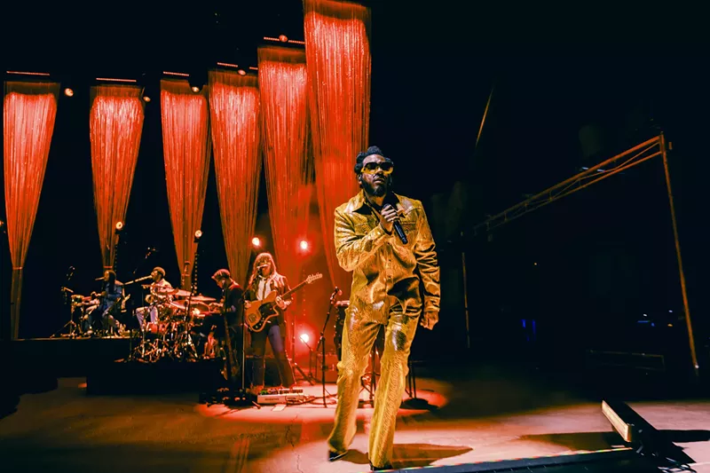 Image: Leon Bridges performing on stage at Red Rocks for his The Leon Tour.
