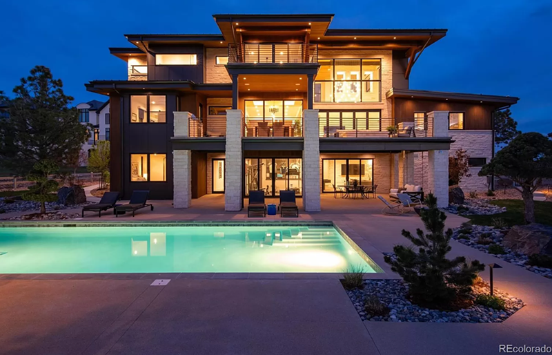 Image: Colorado mcmansion at night with pool