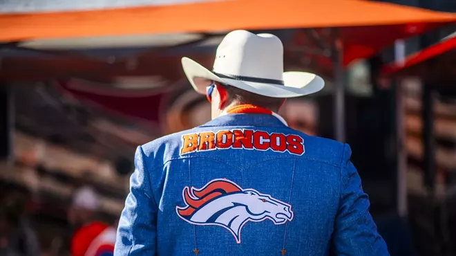 man in broncos cowboy hat and jacket.