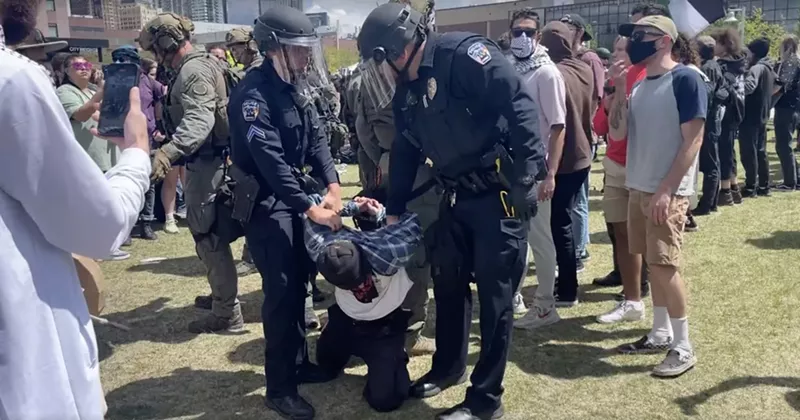 Image: law enforcement with protesters