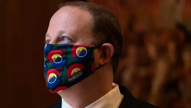 Image: A mask is once again a regular part of Governor Jared Polis's wardrobe.