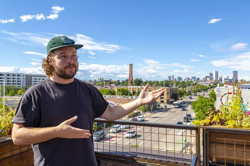 Image: man gesturing at skyline