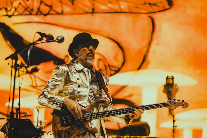Image: Les Claypool performing on stage at Red Rocks.