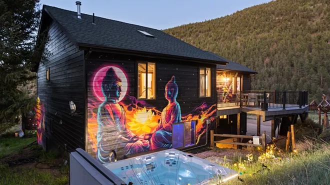 A colorful mural and hot tub