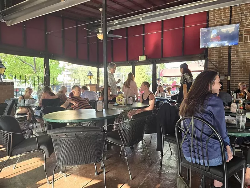 Image: people on enclosed outdoor patio