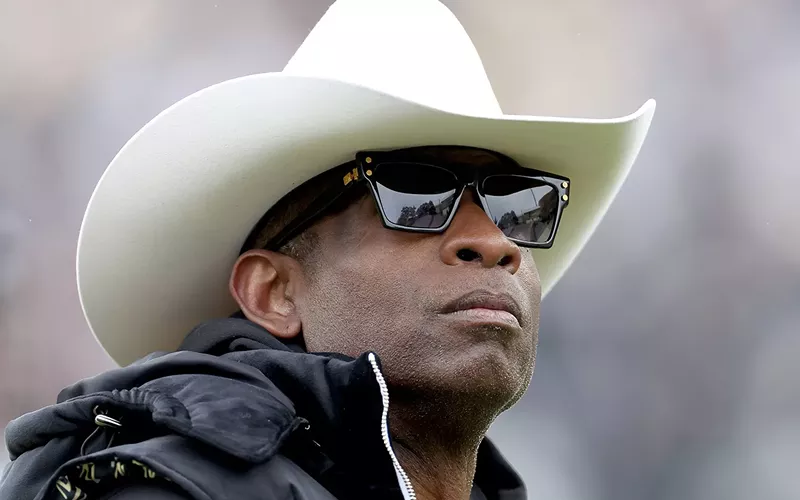 Image: black man in sunglasses and cowboy hat