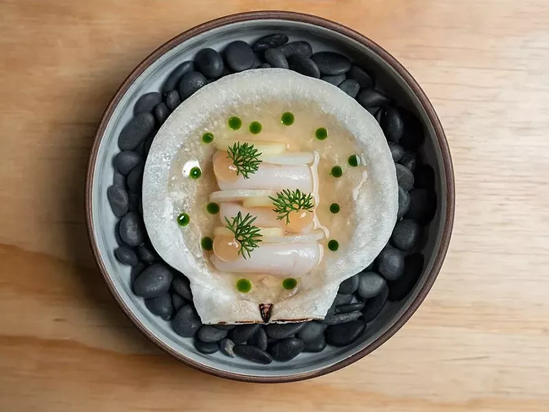 Image: A scallop dish from Byron Gomez's first menu at Michelin-starred Brutø.