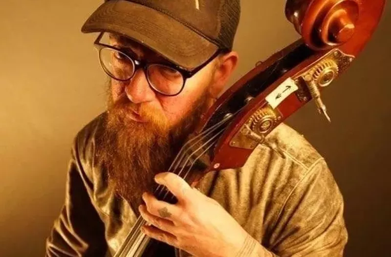 Image: Geoff Robinson playing an upright bass