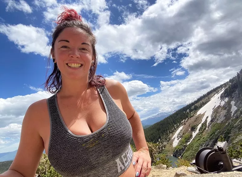 Image: woman smiling on a hike