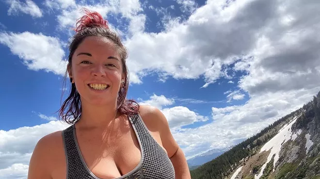 woman smiling on a hike