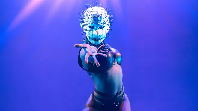 a performer in a mask