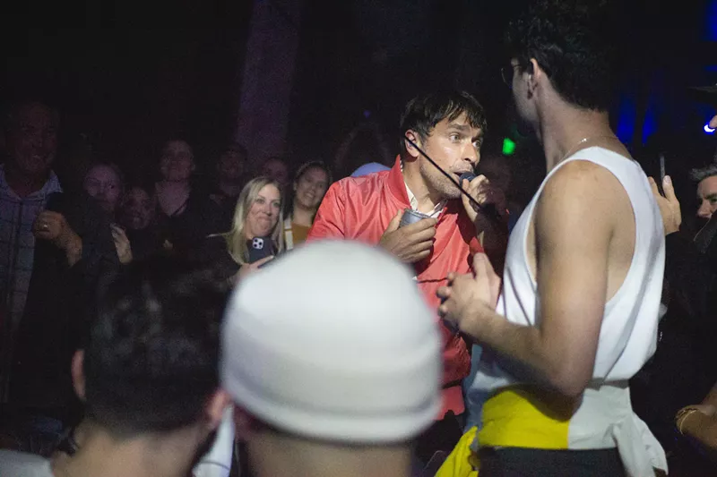 Image: A vocalist sings from out in the audience
