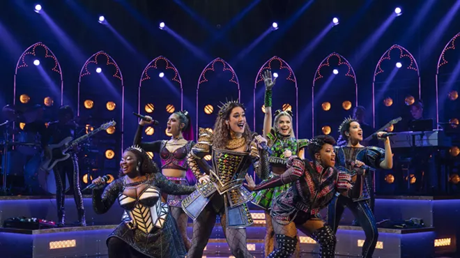 six women on stage in medieval costumes