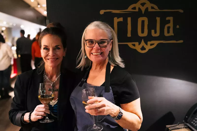 Image: two women toasting