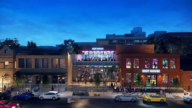 Image: a club with people dancing on the roof.