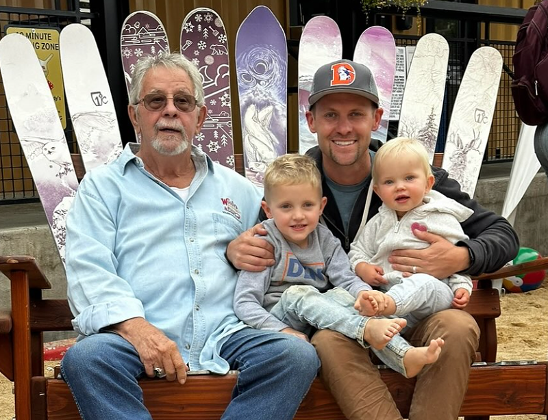Image: family sitting on a bench made of skis