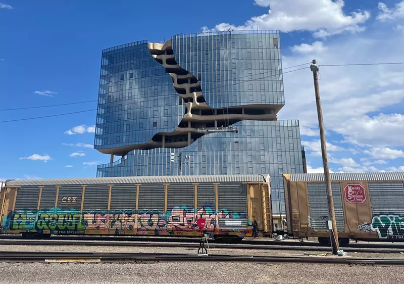 Image: One River North apartment complex behind train track in Denver