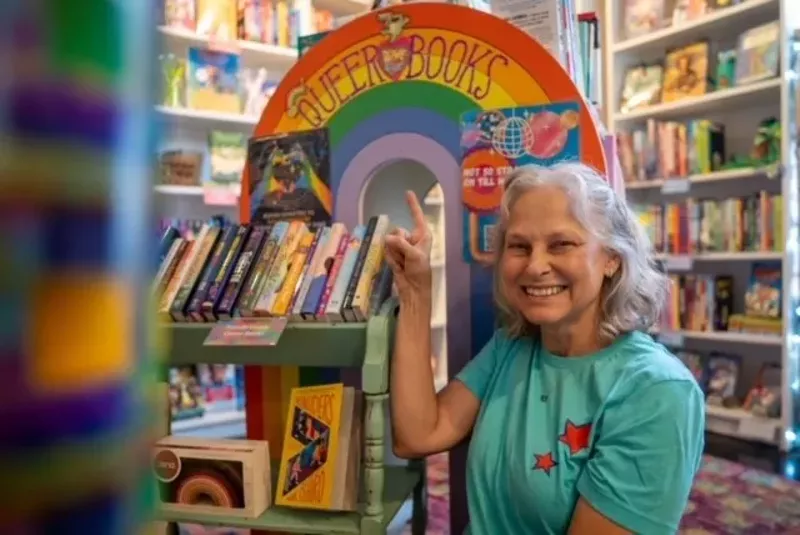 Image: woman smiles in children's book store