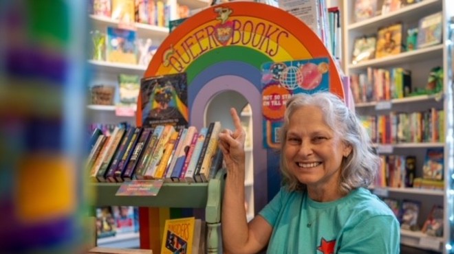 woman smiles in children's book store