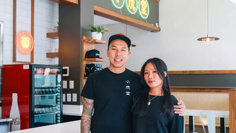 Image: a man and a woman in black shirts