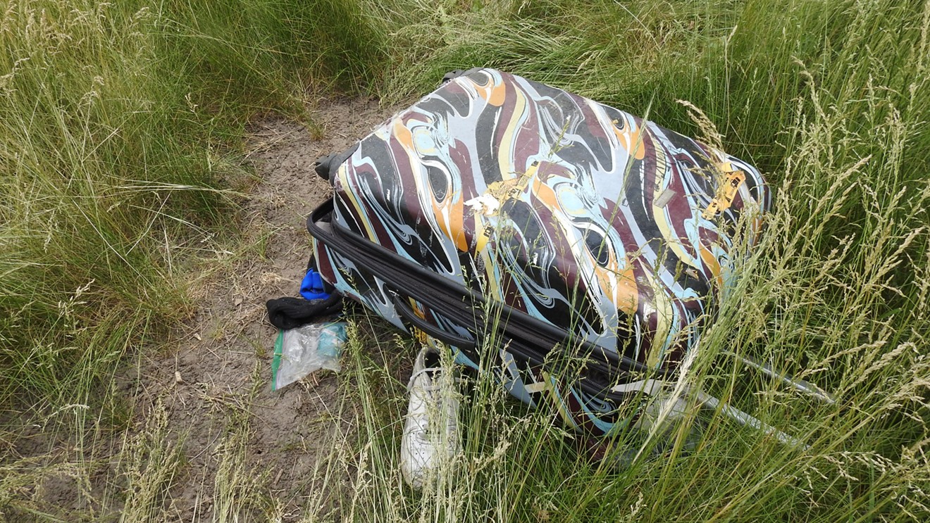 A suitcase found near a man whose body was discovered in June 2021 near the Pecos exit on Interstate 70.