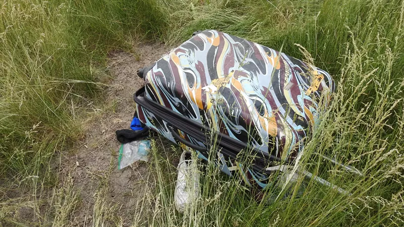 Image: A suitcase found near a man whose body was discovered in June 2021 near the Pecos exit on Interstate 70.