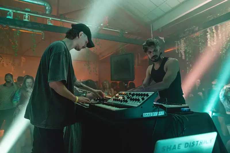 Image: two djs performing