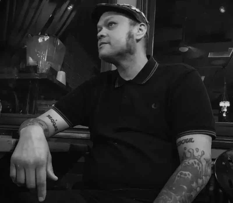 Image: Longtime Goosetown Tavern doorman and DJ Tommy Borrero.