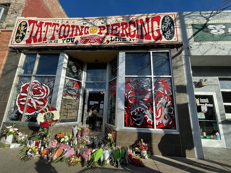 Sol Tribe, which announced it is closing, was covered in flowers after the December 27, 2021 shooting.