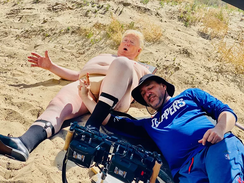 Image: A fat man and a camera guy