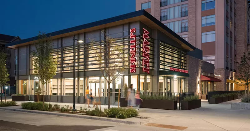 Image: exterior of a building with a red sign