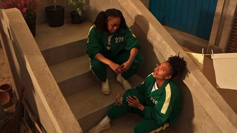 Image: Two women sitting on steps.
