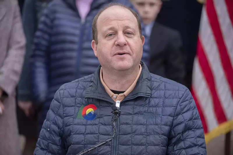 Image: A man in a down jacket with the Colorado logo.