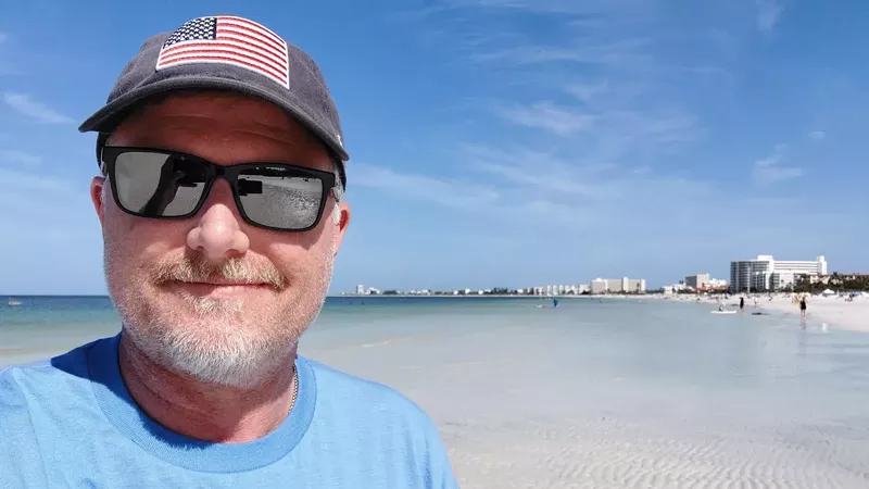 Image: man in sunglasses on beach