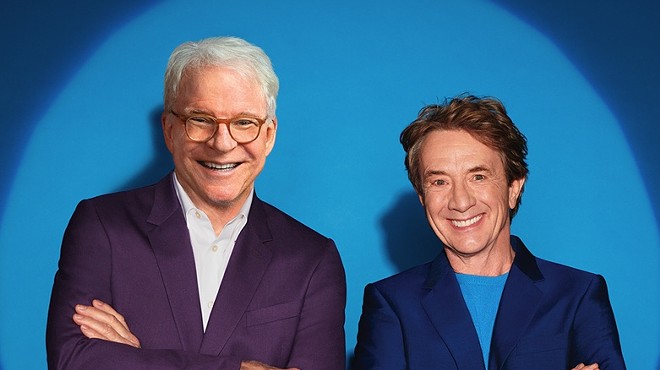 steve martin in a white shirt and purple jacket and martin short in a blue shirt and jacket