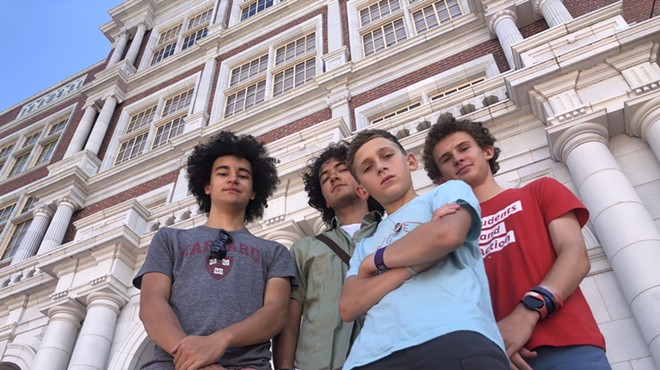 From left: Beckett Nelson-Gardner, Caden Fiala, Seth Shurz and Noah Shurz standing in front of East High School.