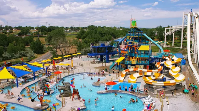 An aerial view of Water World, featuring a pool, slides and a lazy river