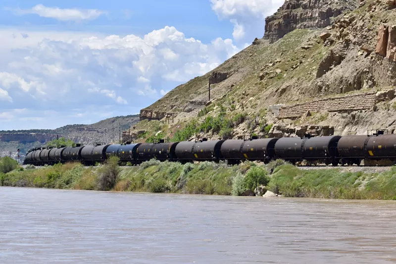 Image: railcars along a river