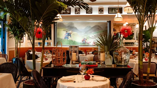 A fancy dining area with plants