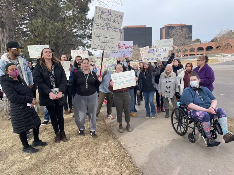 Image: a group of people holding posters