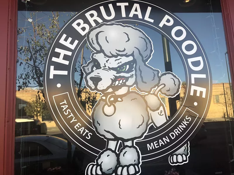 Image: door with poodle sign