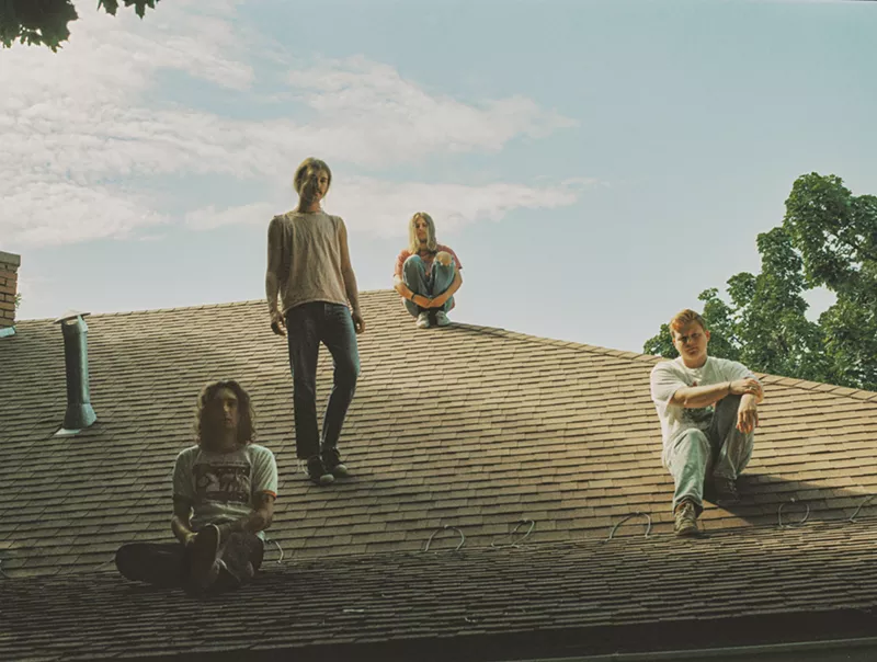 Image: four men on a hill