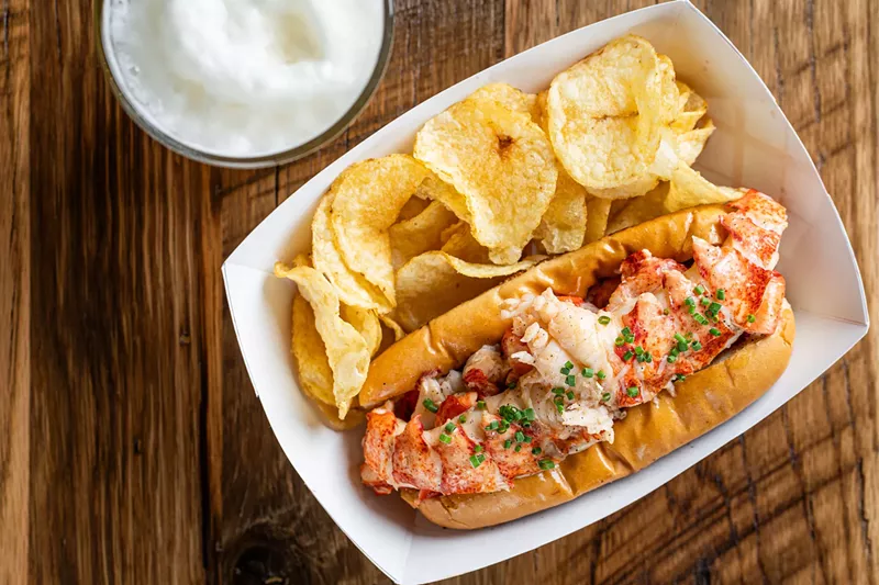 Image: lobster roll in paper baskets on wood table