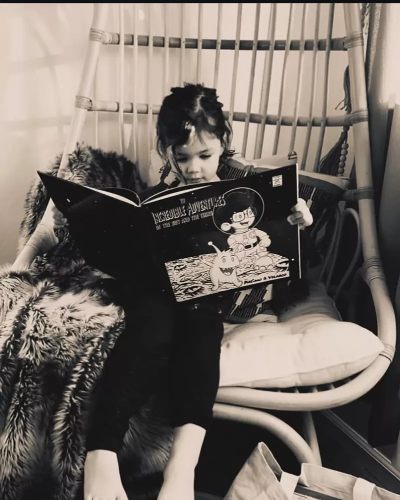 Image: A girl reads a book